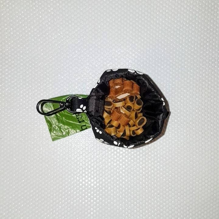 Leopard print dog treat bag with poo bag holder compartment and drawstring opening/closing