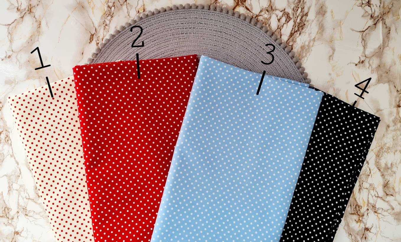 Polka dot print face mask. Washable and reusable with filter pocket. Adjustable elastic ear loops with toggle adjustment.