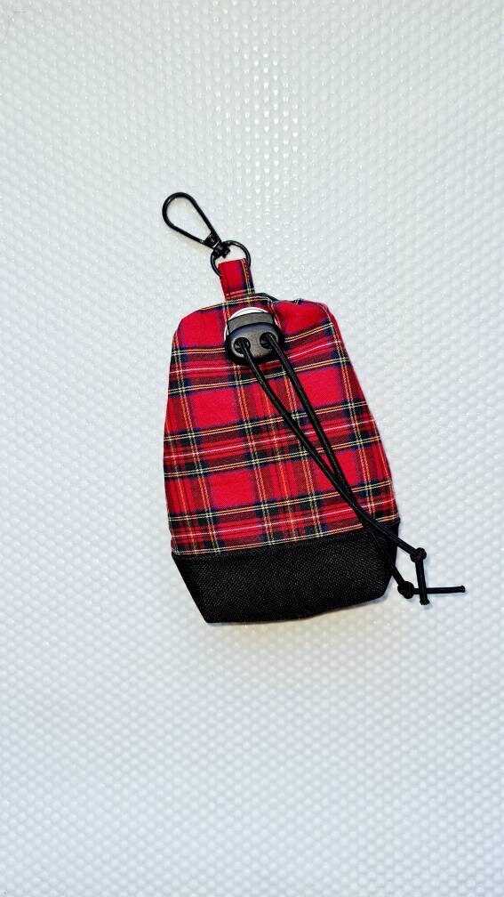 Red tartan dog treat bag with poo bag holder compartment and drawstring opening/closing