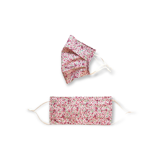 Pink ditsy face mask. Washable and reusable with filter pocket. Adjustable elastic ear loops with toggle adjustment.